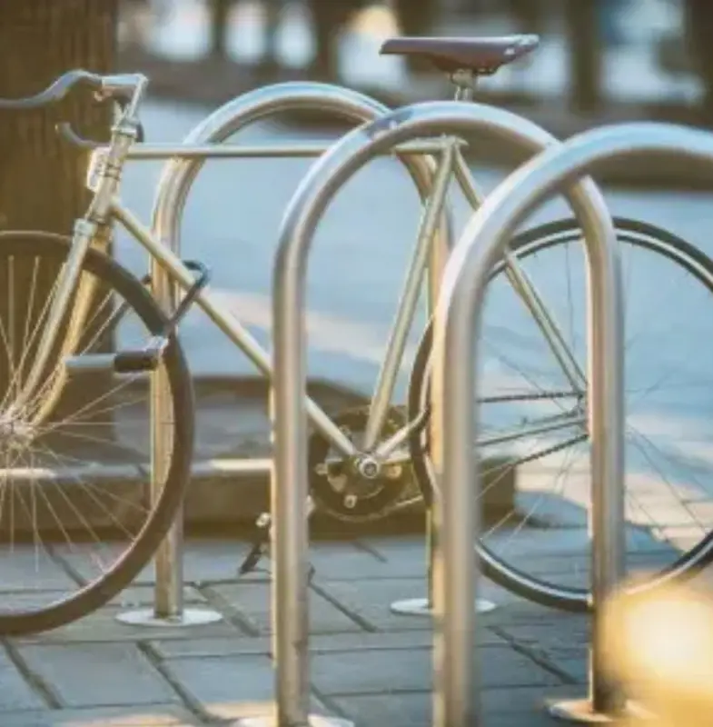 Stainless steel hoop cycle stands with a bike locked to them
